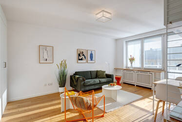 Light-flooded apartment with designer furniture
